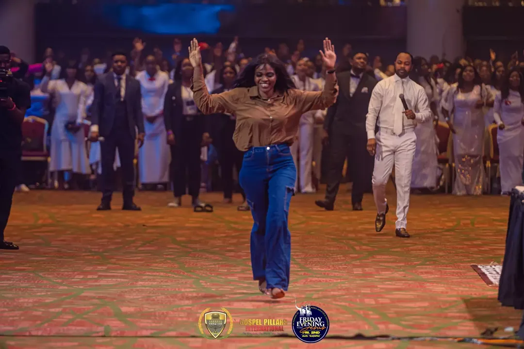 A testifier celebrating a life-changing encounter at An Evening With Jesus