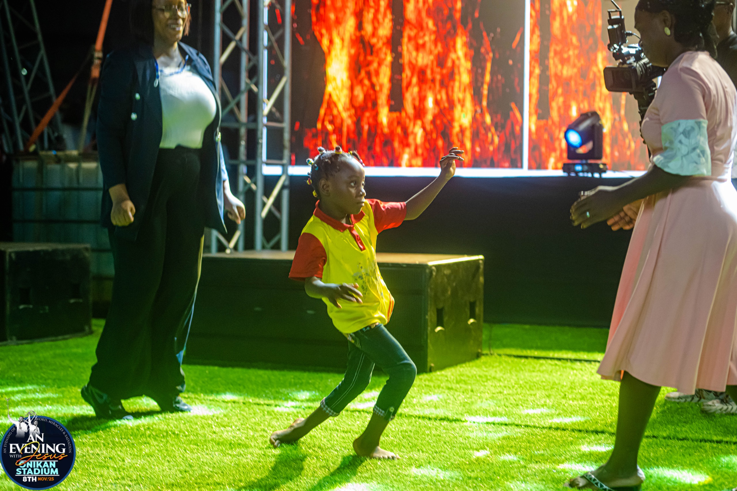 A young girl dancing on stage at An Evening With Jesus, Onikan Stadium