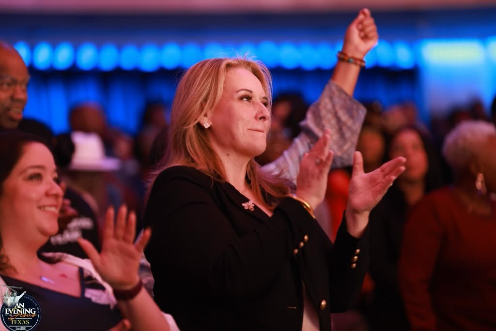 Worshippers clapping in praise at An Evening With Jesus, Texas